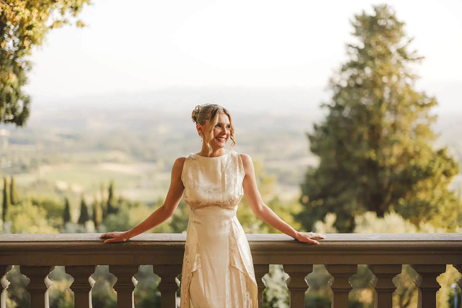 Beautiful bride on the main panoramic terrace of Villa Belvedere in Loro Ciuffenna