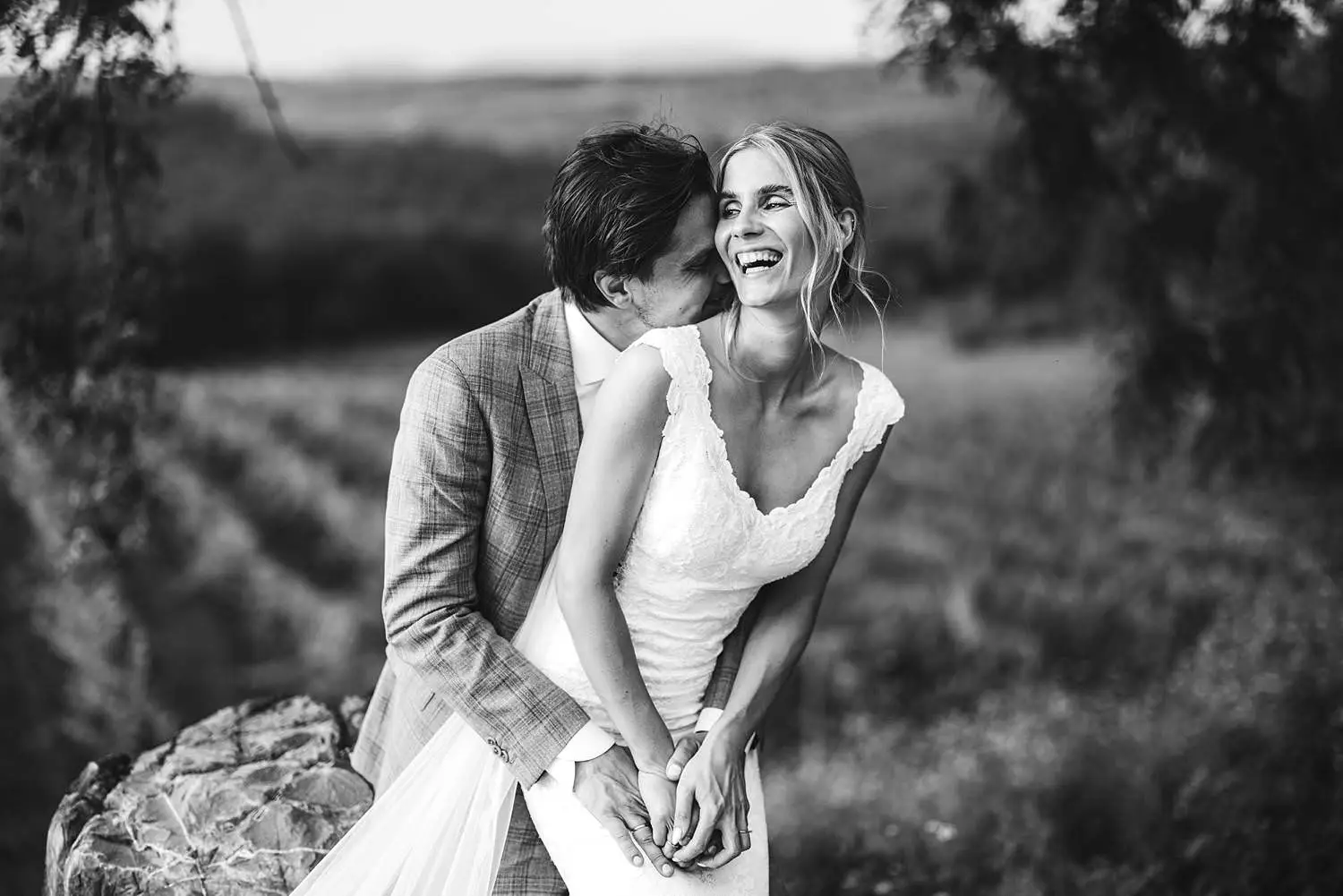A timeless candid bride groom portrait overlooking Chianti vineyard at Agriturismo Quercia al Poggio