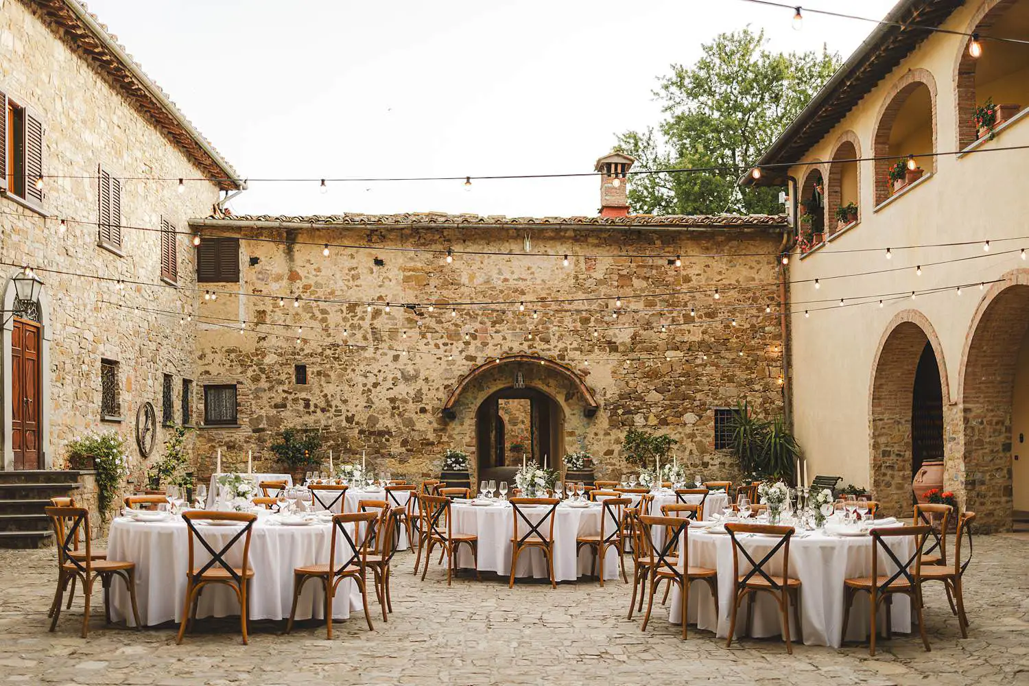 Elegant and minimal wedding dinner setup at Quercia al Poggio