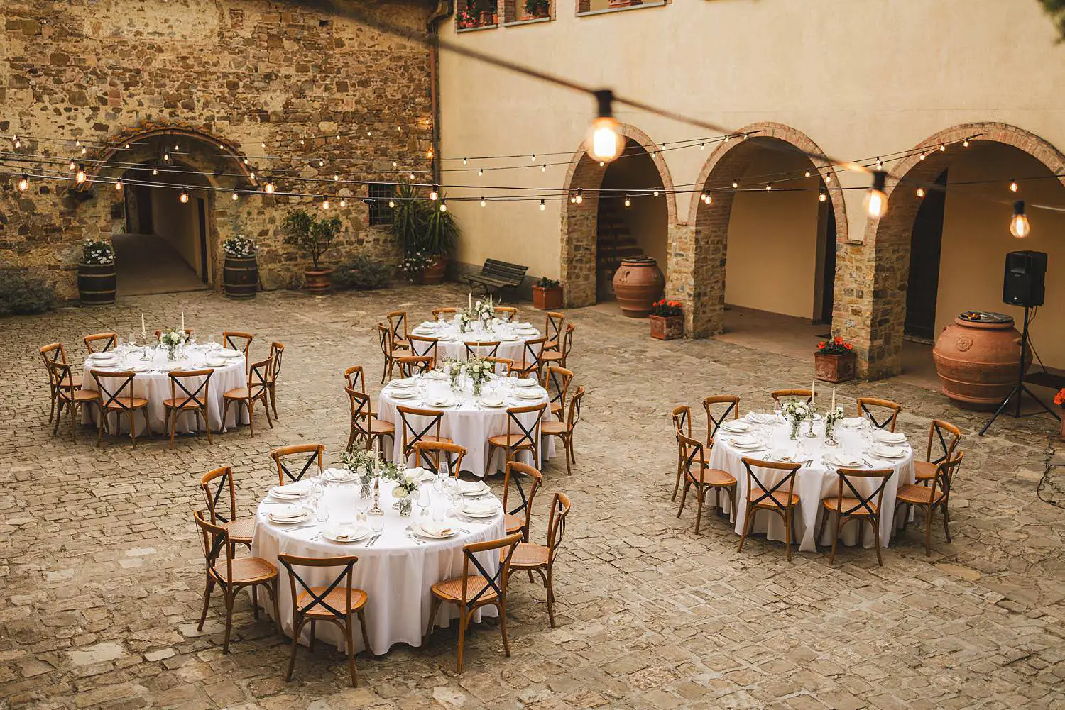 Elegant and minimal wedding dinner setup at Quercia al Poggio