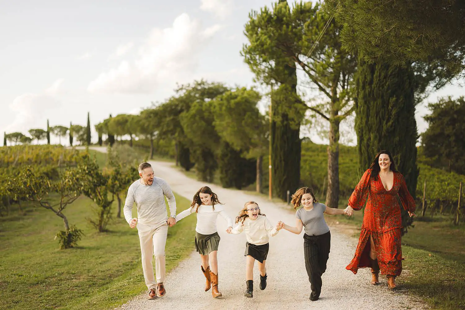 Family photographer in Tuscany at Terra Antica Winery Resort Siena countryside in the Val d’Orcia