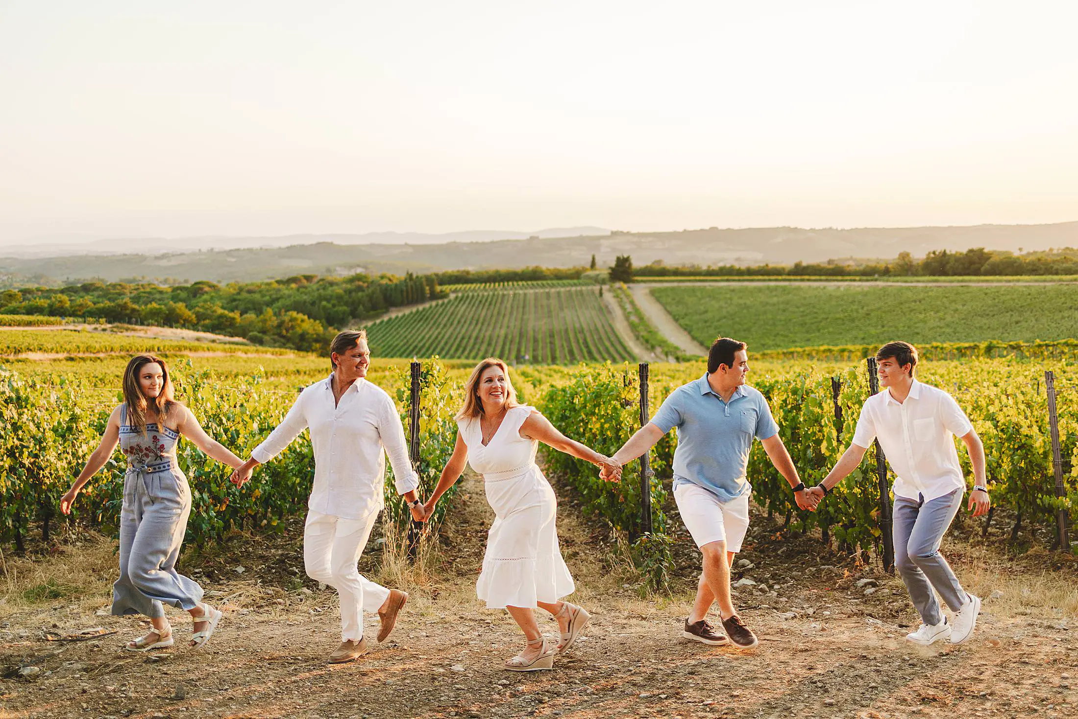 Candid family photos among vineyards and golden light at Borgo San Felice