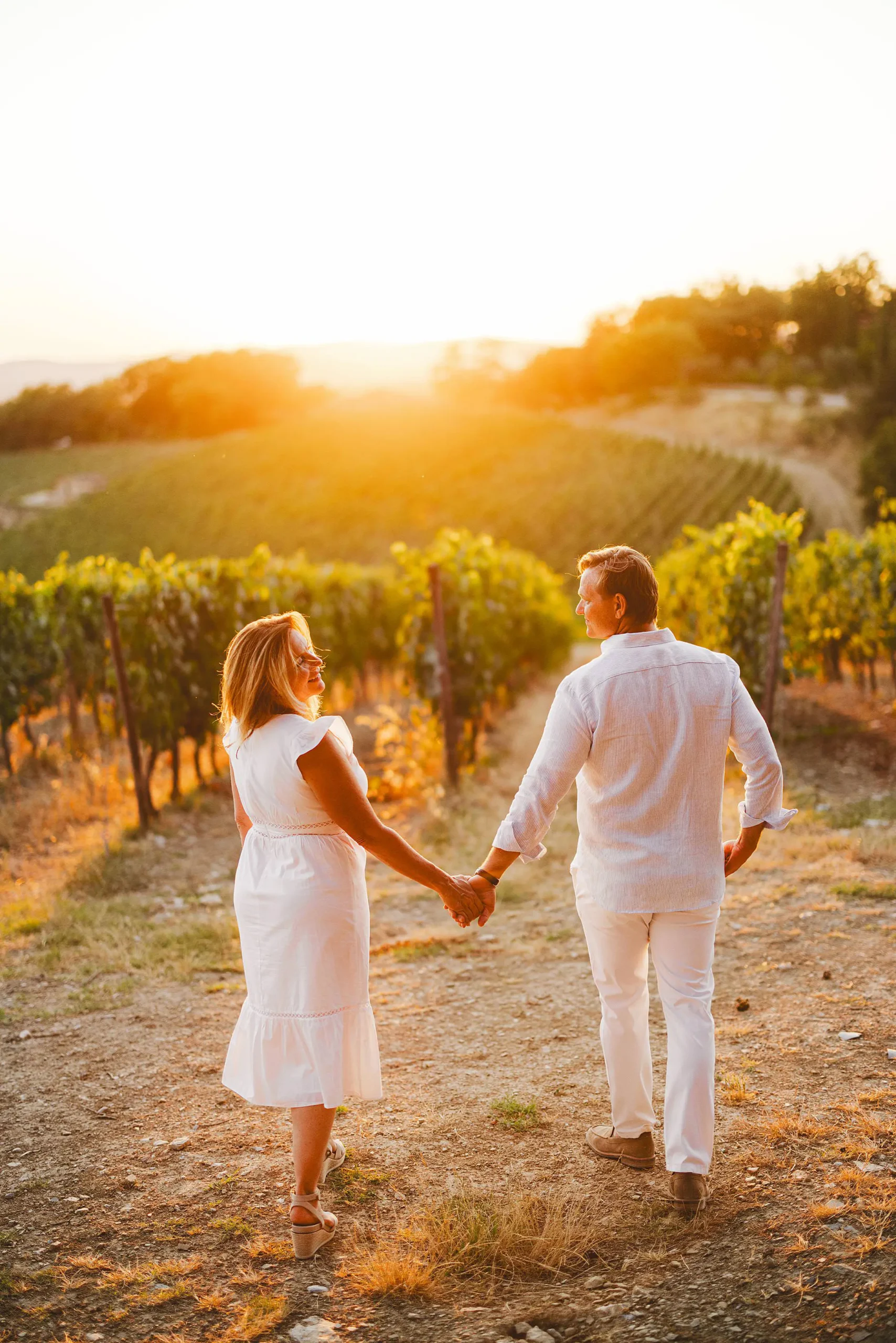 Candid family photos among vineyards and golden light at Borgo San Felice