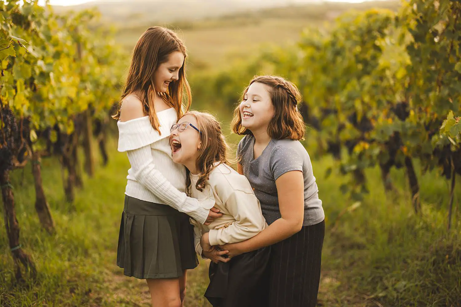 Candid and spontaneous family photographer in Tuscany Italy at Terra Antica Winery Resort in Siena