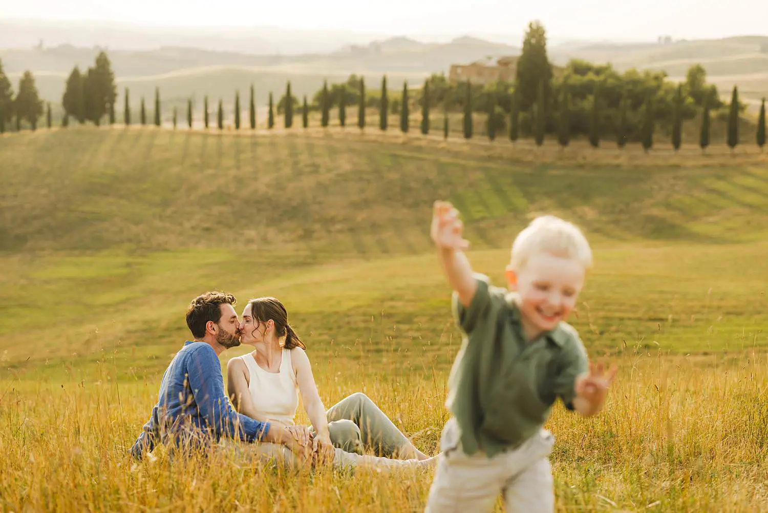 Lovely family shoot in evocative rolling hills and iconic cypress-lined paths in Certaldo countryside
