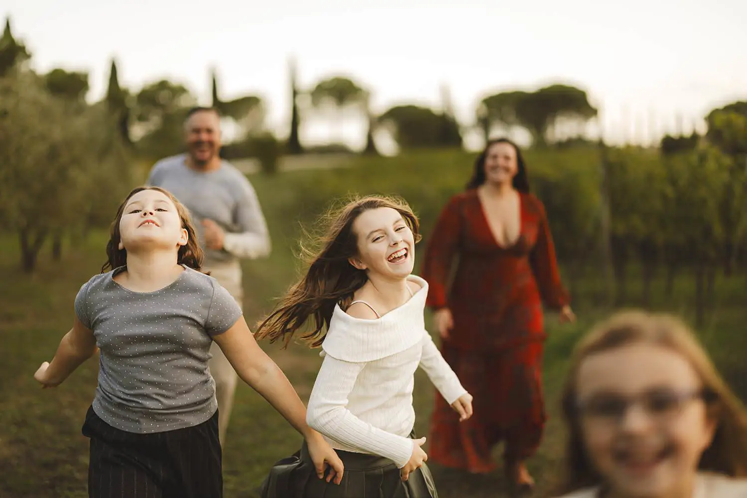 Candid and spontaneous family photographer in Tuscany Italy at Terra Antica Winery Resort in Siena