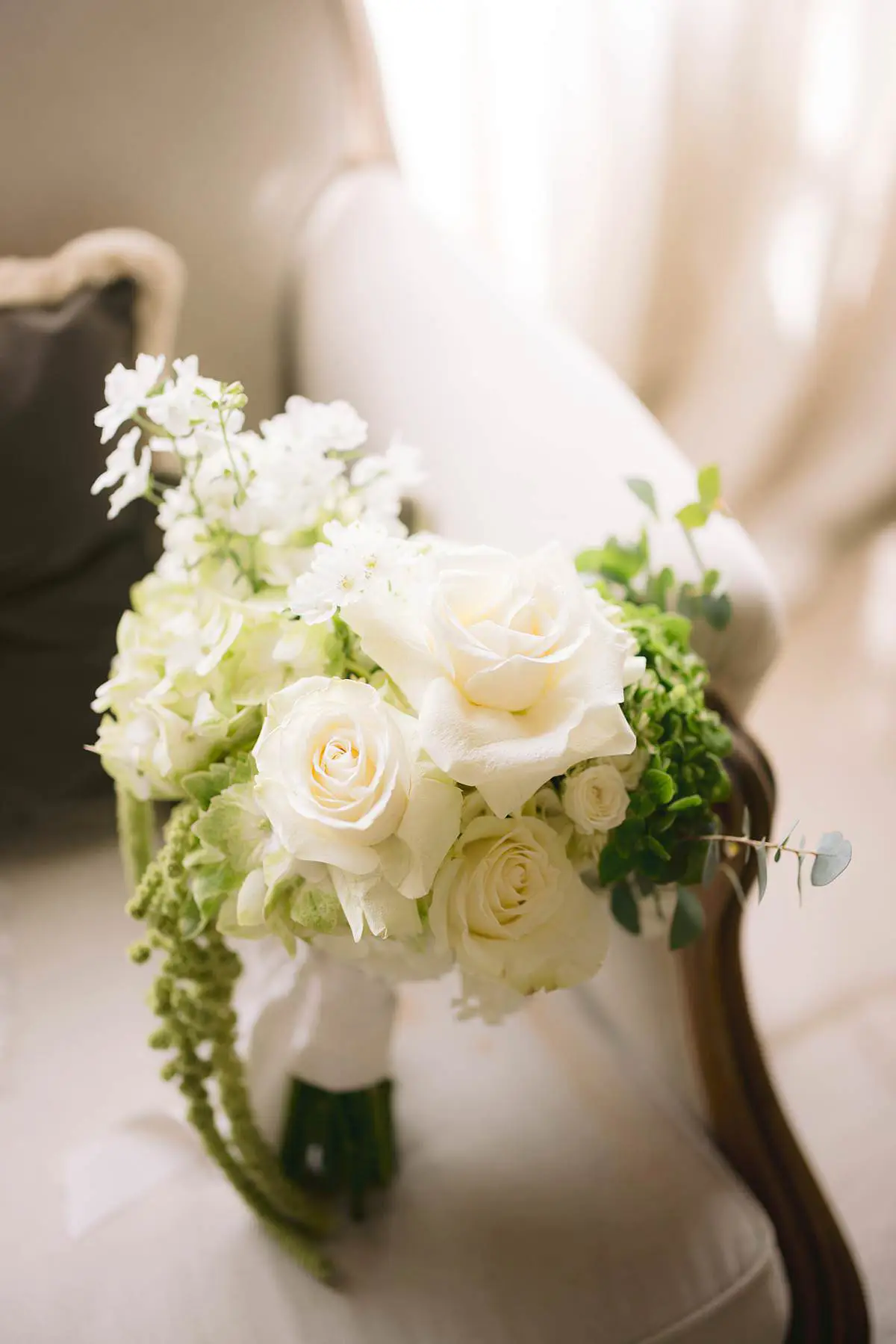 White rose wedding bouquet held by the bride at Villa Le Fontanelle.