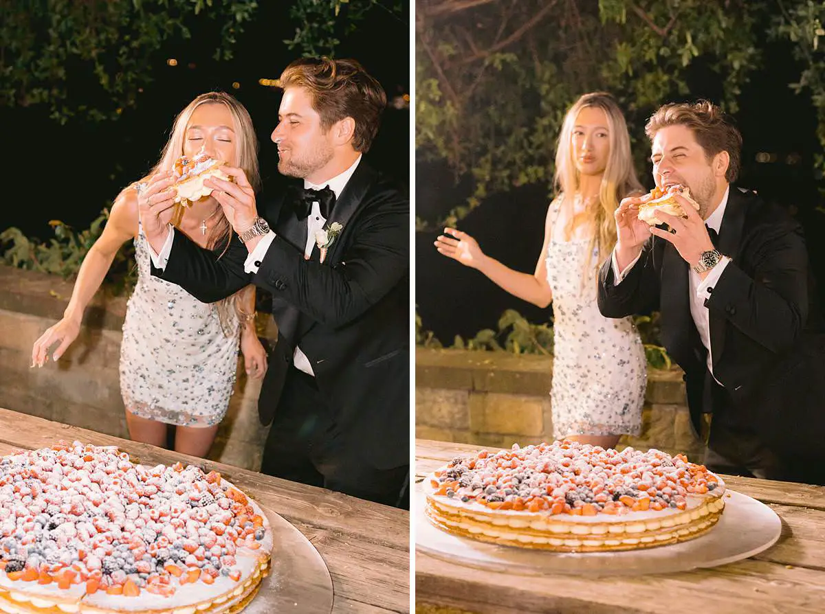 Newlyweds celebrate beside a berry-topped wedding cake at Villa Le Fontanelle.